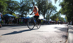 Female on bike from Ciclovia website