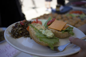 reusable plate with vegetarian bunwich and metal fork