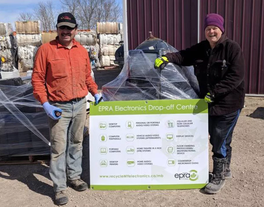 first nations community residents posing near recyclables guideline poster