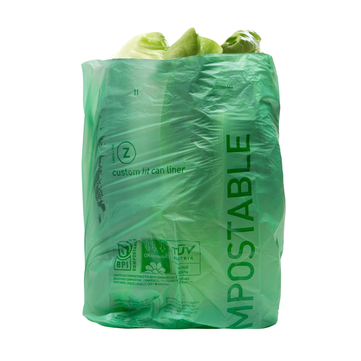 Picture of a green compostable plastic bag with lettuce inside.