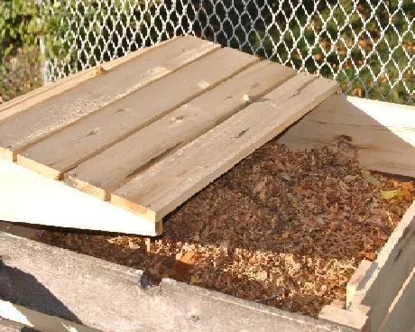 composting leaves stored in bin