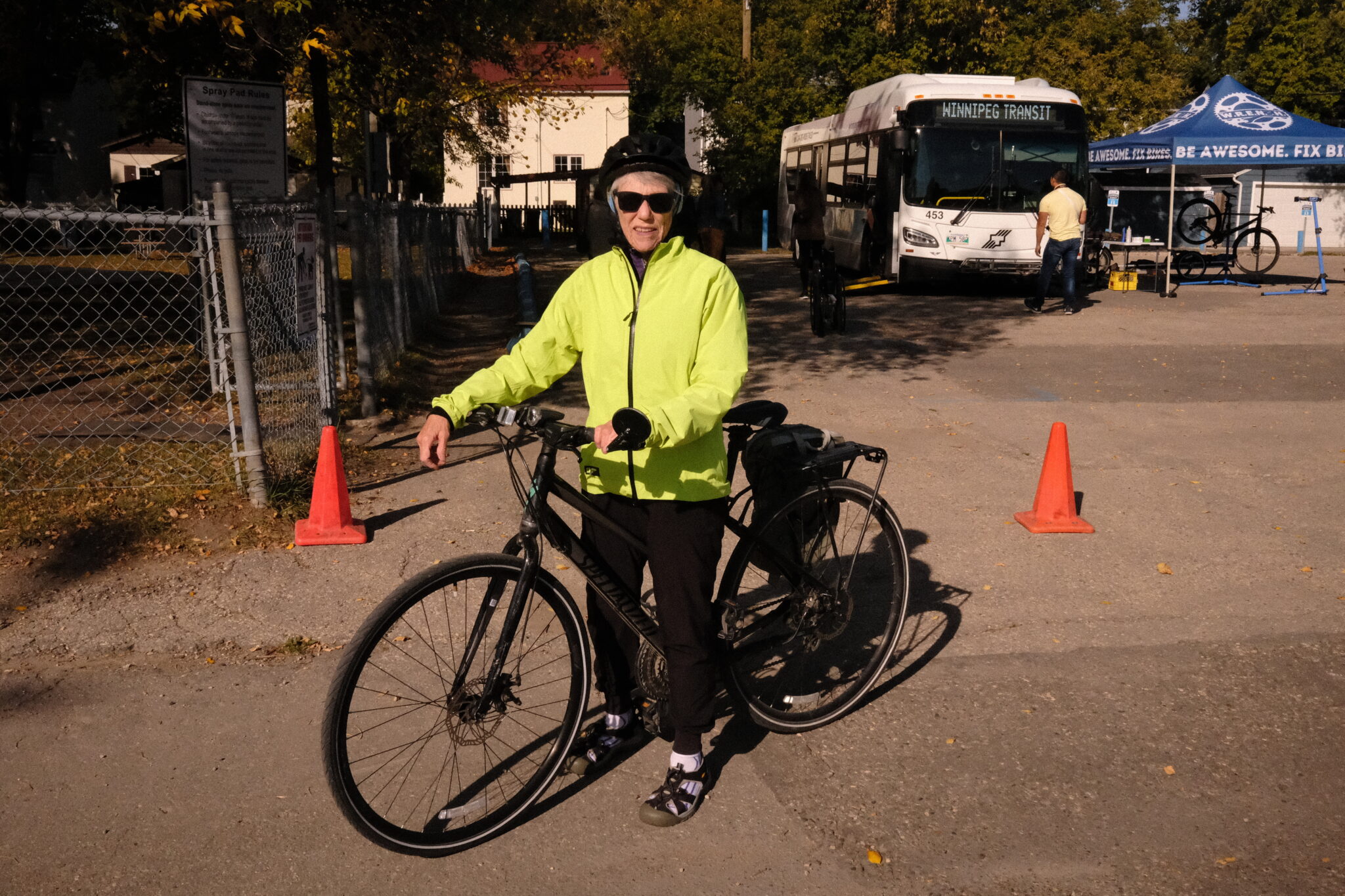 A woman poses with her bike