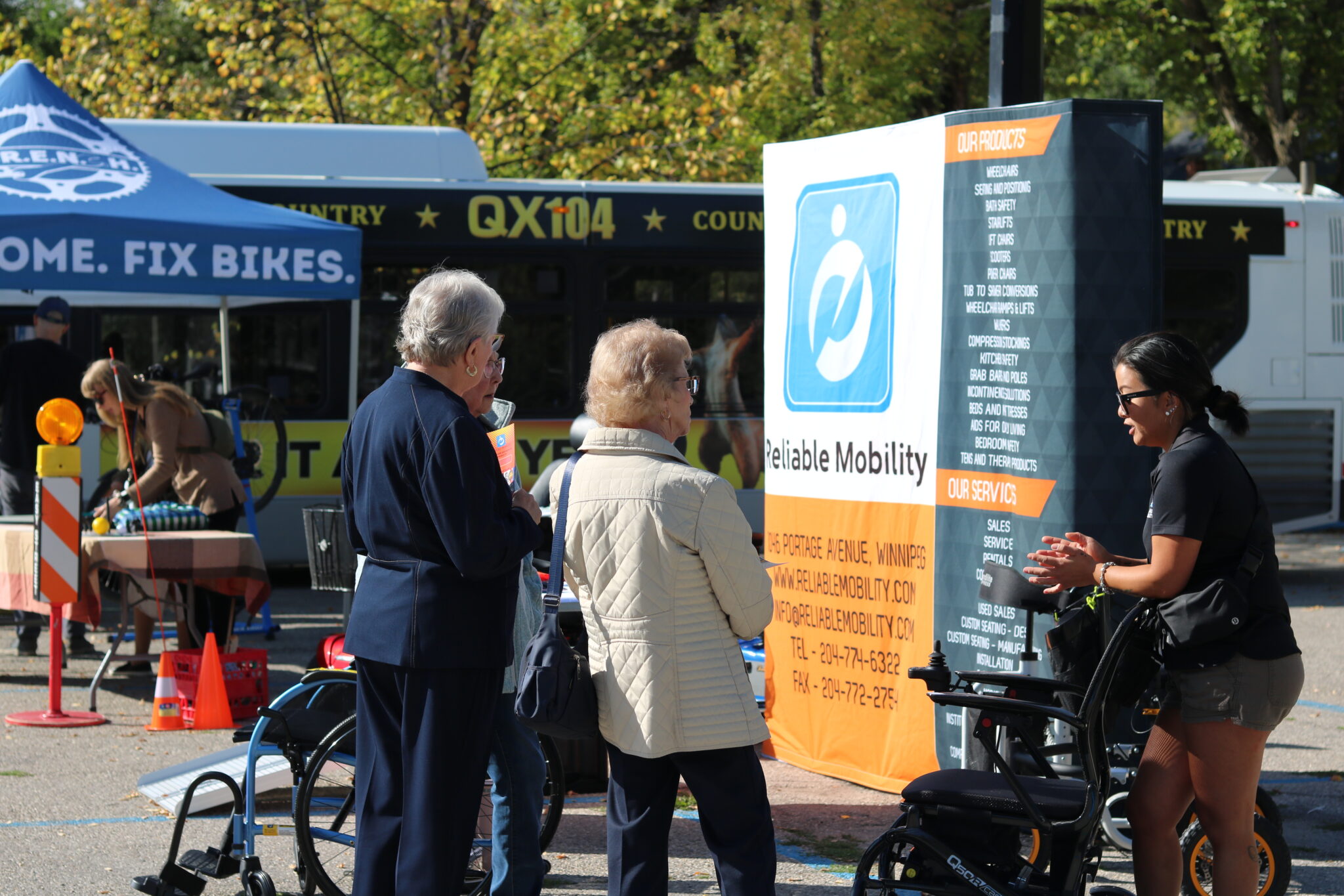 People listen as a vendor from Reliable tells them about their products 