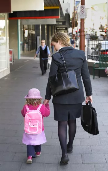 woman walking child