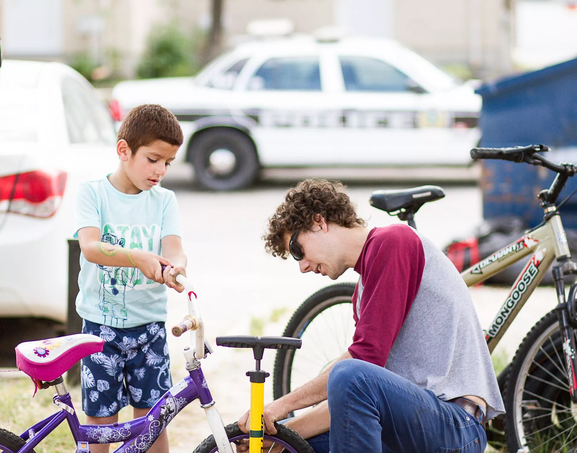 2 boys fixing a bike