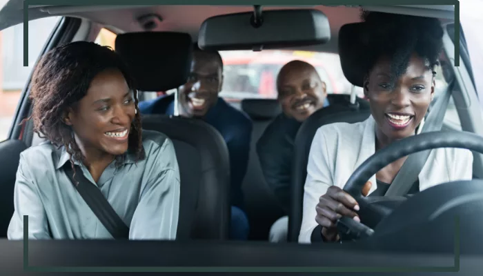 family sitting in a car